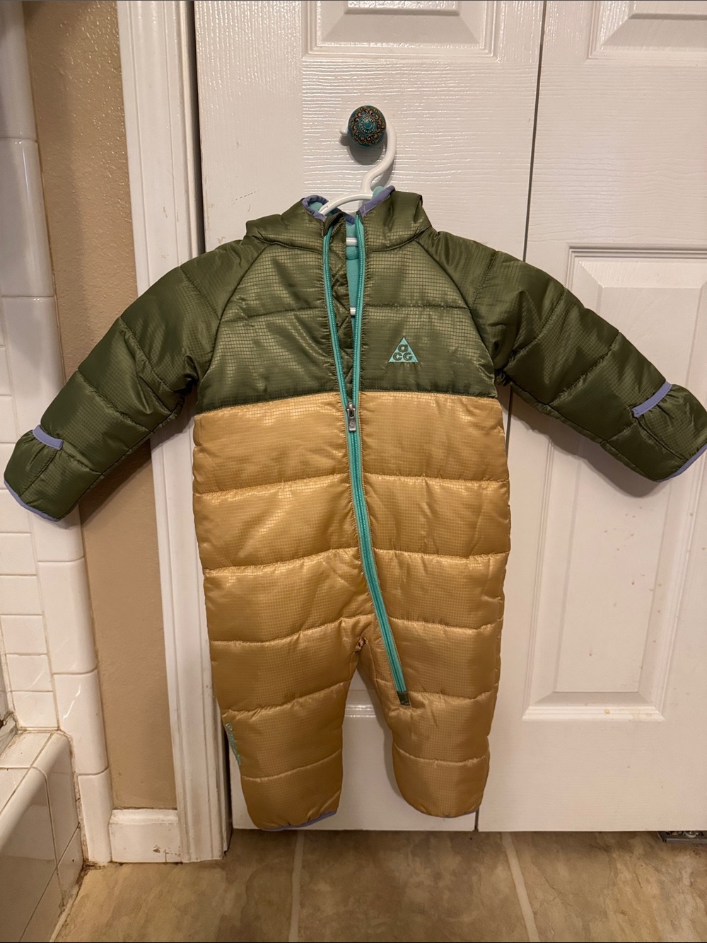 Nike ACG Baby Insulated Snowsuit featuring an olive green and tan colo